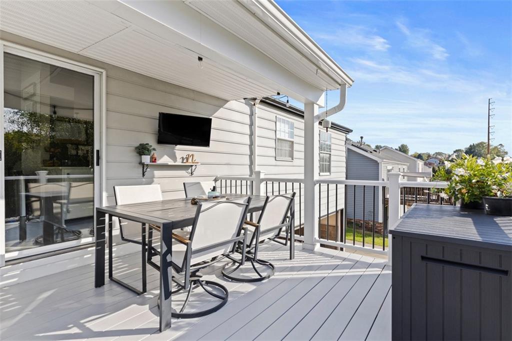 5079 Windriver Drive McKees Rocks, PA 15136 - Photo 35 of 50 a view of a patio with table and chairs with wooden floor and fence