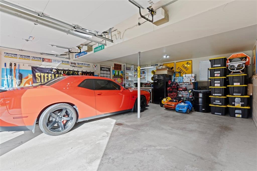 5079 Windriver Drive McKees Rocks, PA 15136 - Photo 38 of 50 a view of parking garage with cars and a car