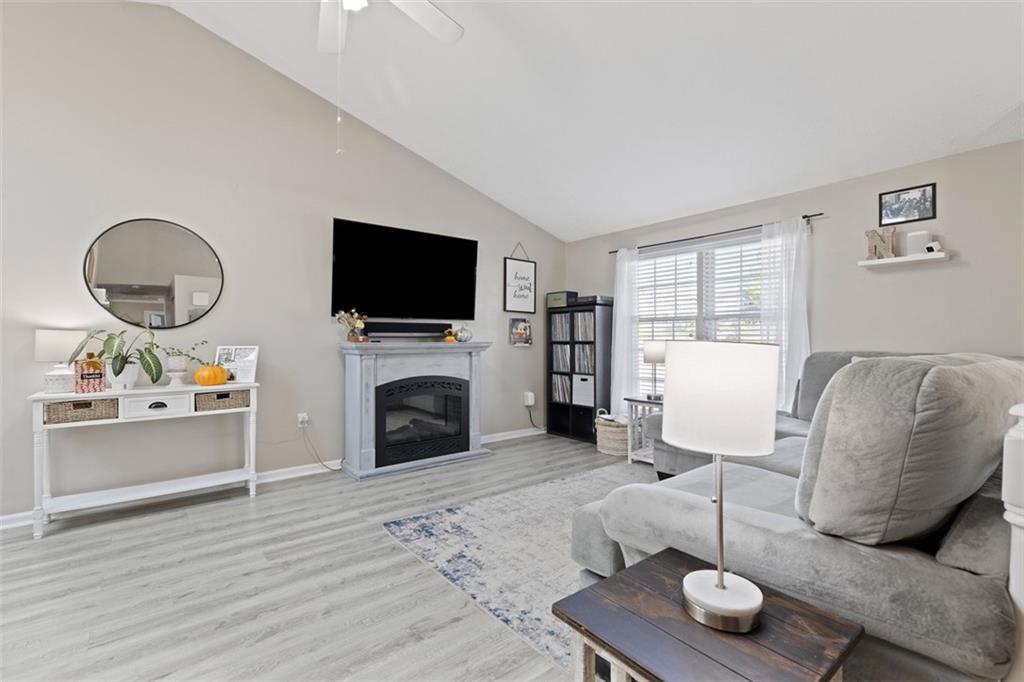 5079 Windriver Drive McKees Rocks, PA 15136 - Photo 9 of 50 a living room with furniture a fireplace and a flat screen tv