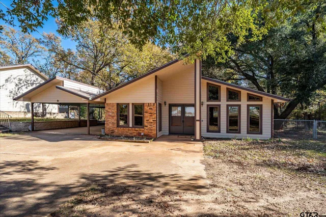a front view of a house with yard and seating area