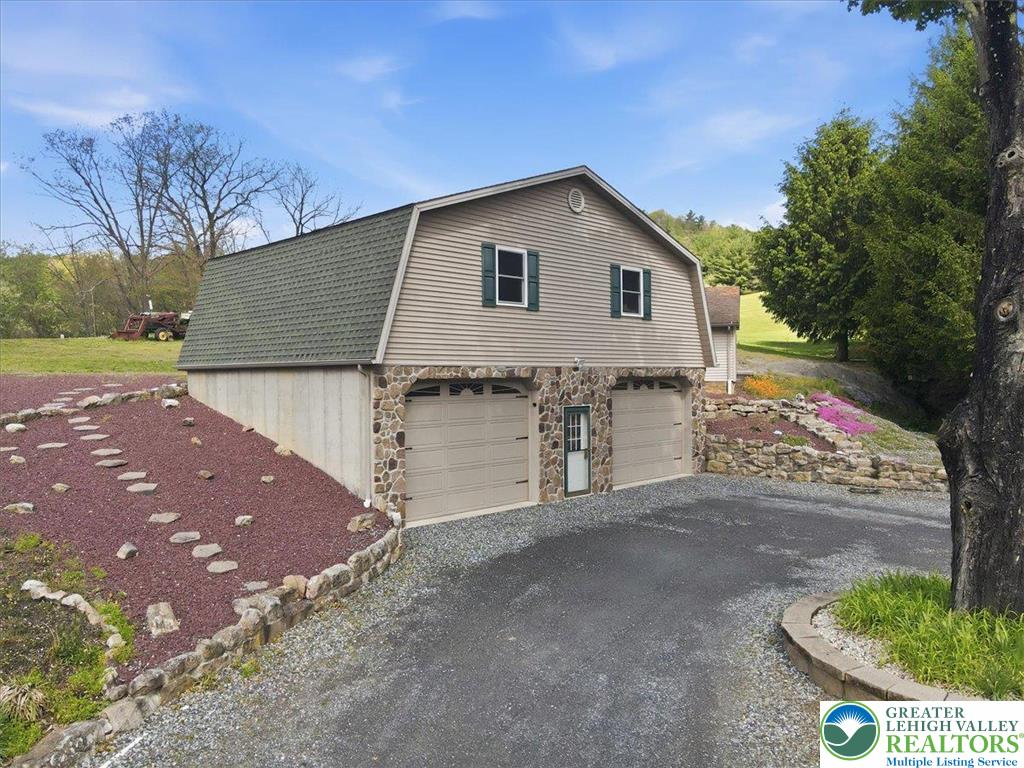 4880 Little Gap Road Kunkletown, PA 18058 - Photo 60 of 100 This charming detached garage with upper-level potential offers practical utility and attractive design.