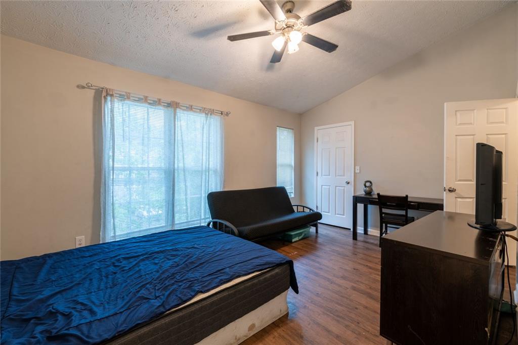 3474 Waldrop Trail Decatur, GA 30034 - Photo 16 of 17 a bedroom with a bed and wooden floor