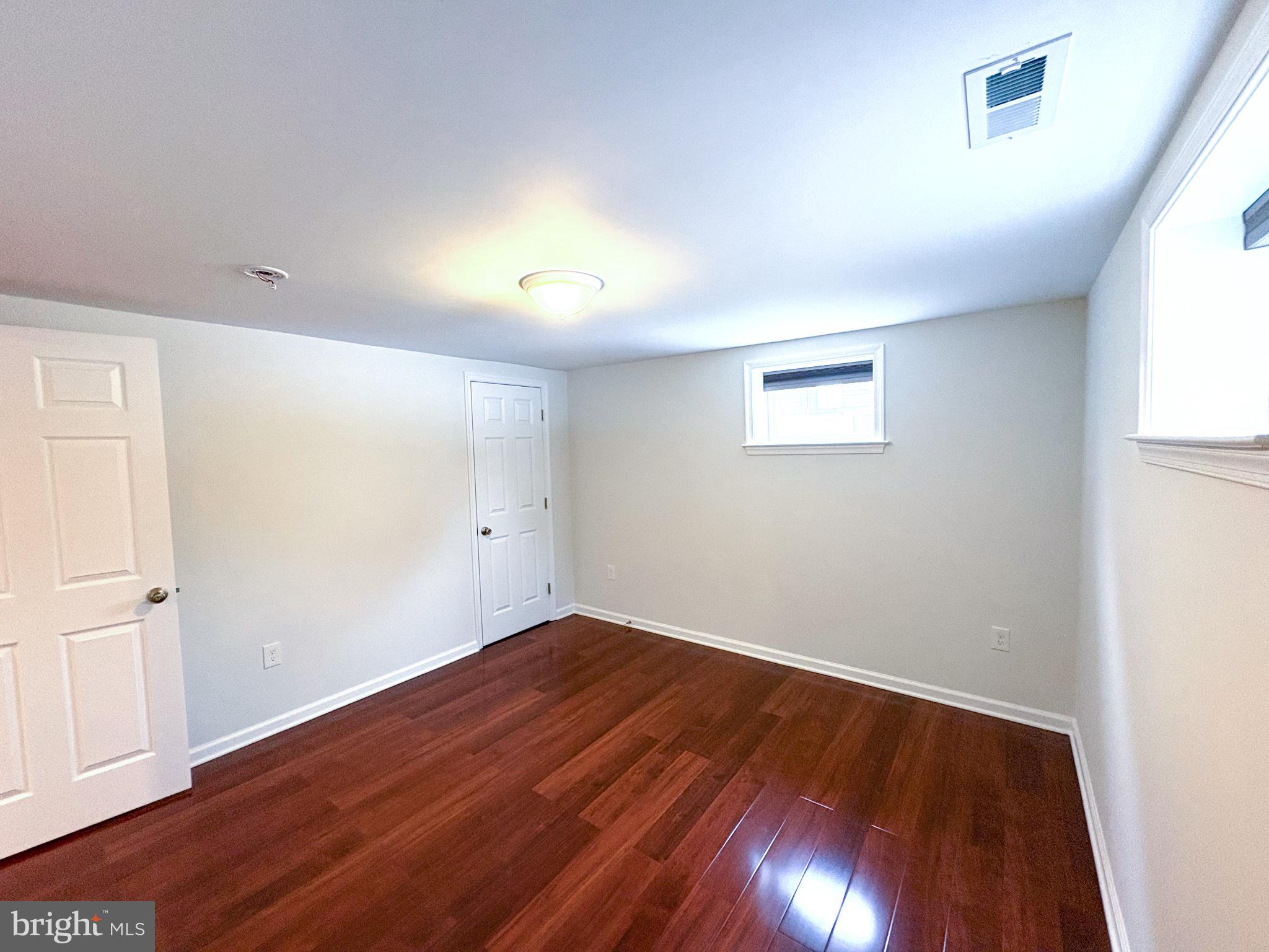4505 Hargrove Road Temple Hills, MD 20748 - Photo 30 of 39 Bright, spacious room with warm wood floors.