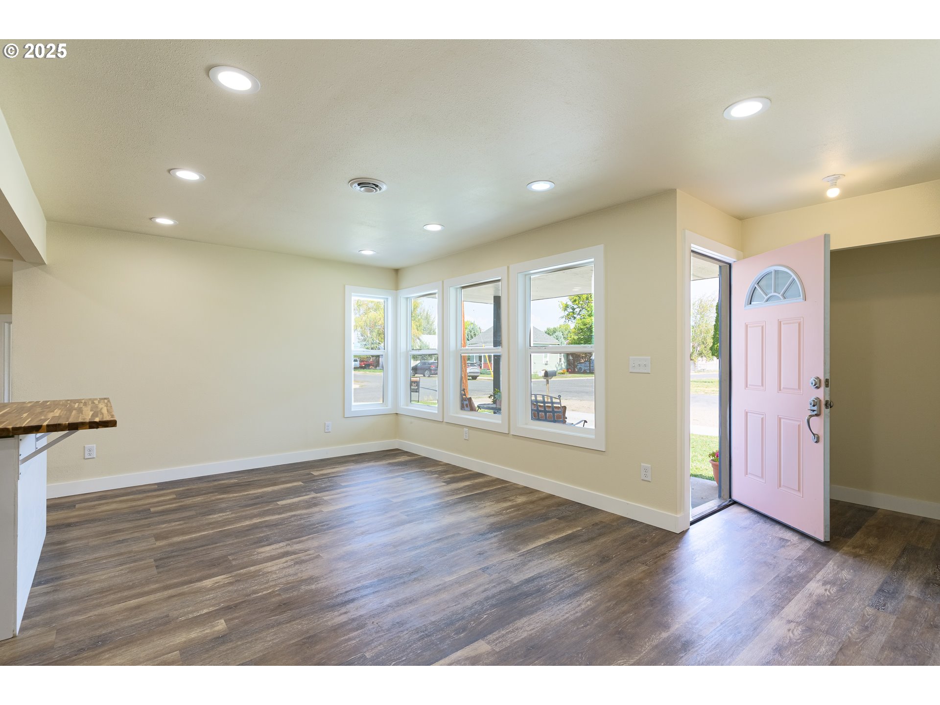 1895 Balm Street Baker City, OR 97814 - Photo 12 of 32 a view of an empty room with wooden floor and a window