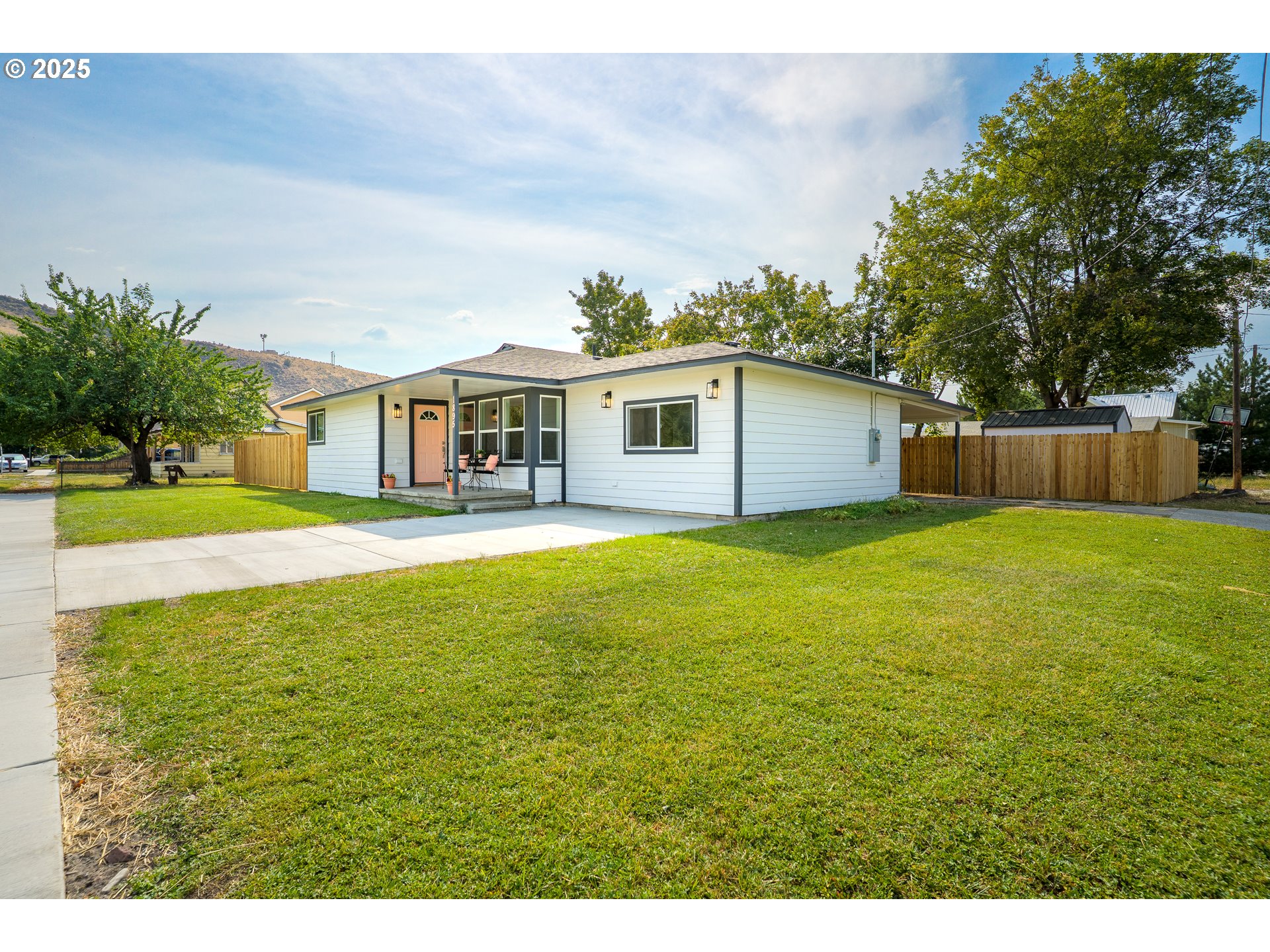 1895 Balm Street Baker City, OR 97814 - Photo 2 of 32 a front view of house with yard and swimming pool