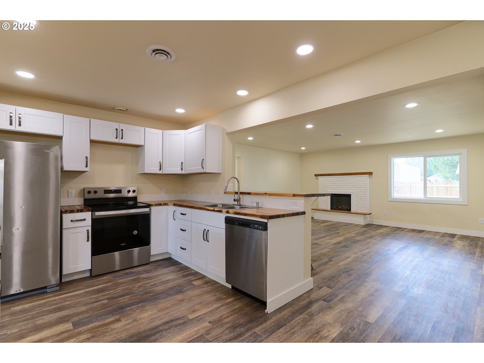 1895 Balm Street Baker City, OR 97814 - Photo 9 of 32 a kitchen with a refrigerator and a stove top oven