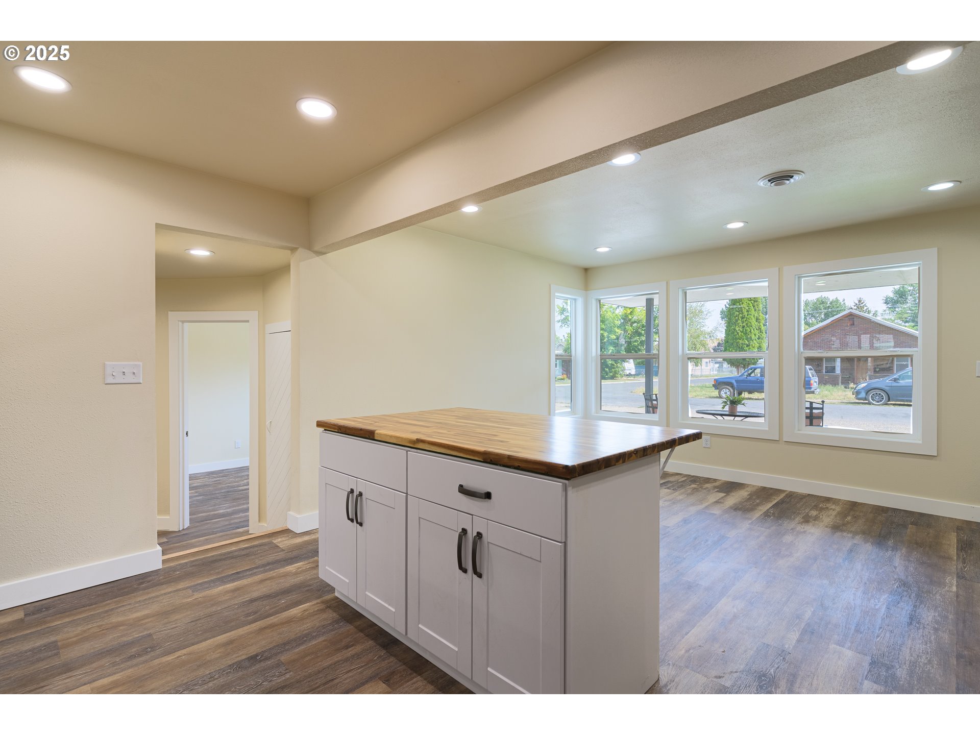 1895 Balm Street Baker City, OR 97814 - Photo 10 of 32 a kitchen with granite countertop a stove and wooden floor