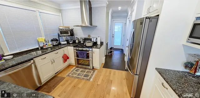 a kitchen with a sink stove and refrigerator