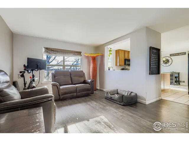 a living room with furniture and window