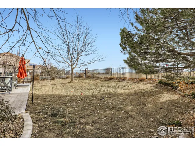 a view of open space with wooden fence