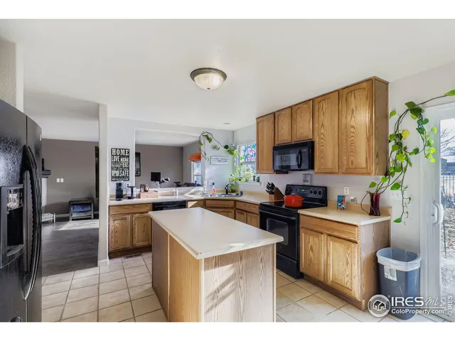 a kitchen with a sink stove and refrigerator