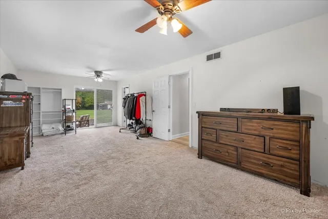 a view of room with furniture and a ceiling fan