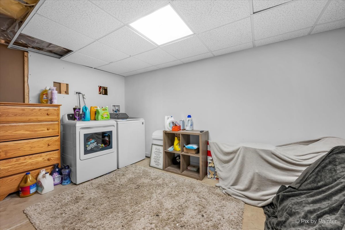 9520 Stacy Lane Union, IL 60180 - Photo 24 of 45 a utility room with dryer washer and a view of living room