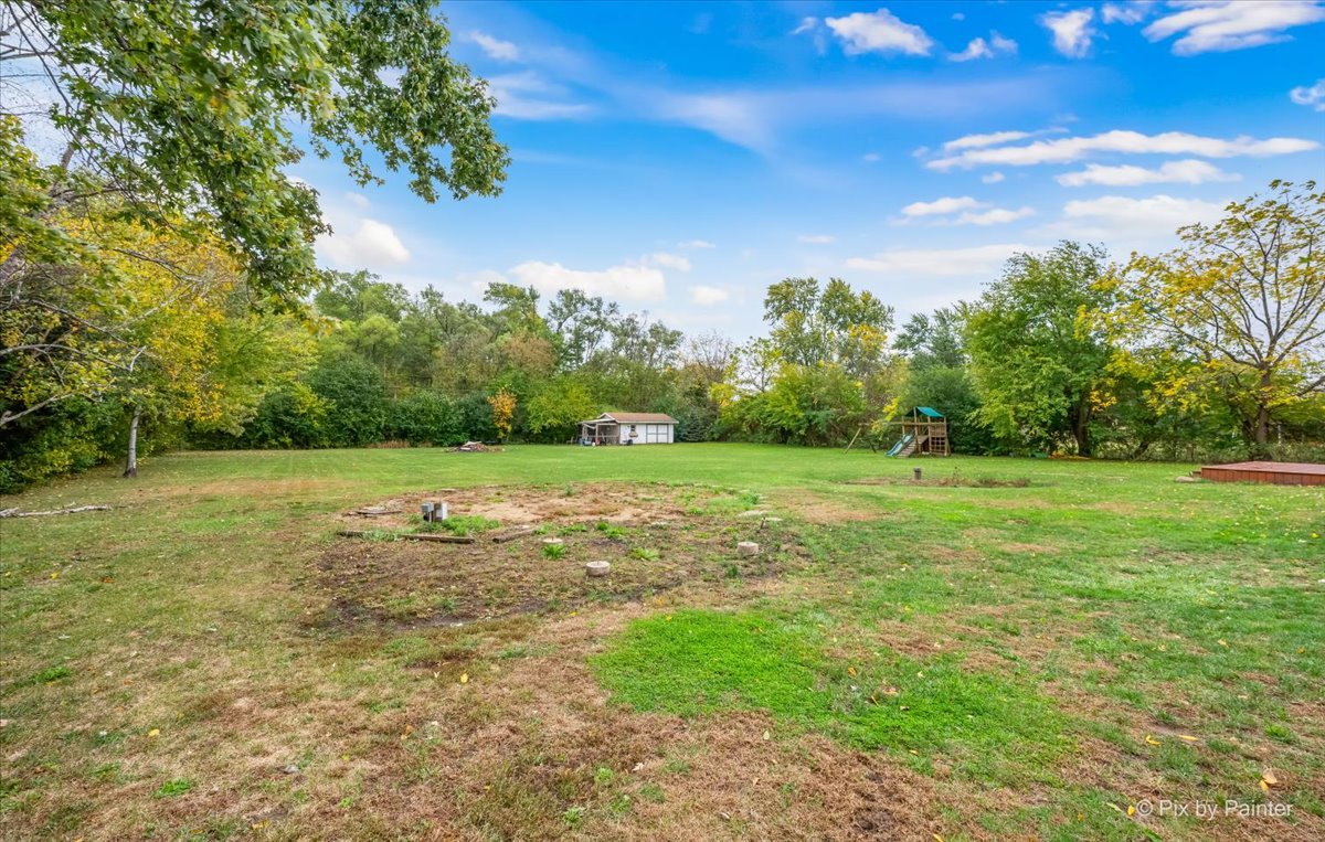 9520 Stacy Lane Union, IL 60180 - Photo 32 of 45 a view of a green field with wooden fence