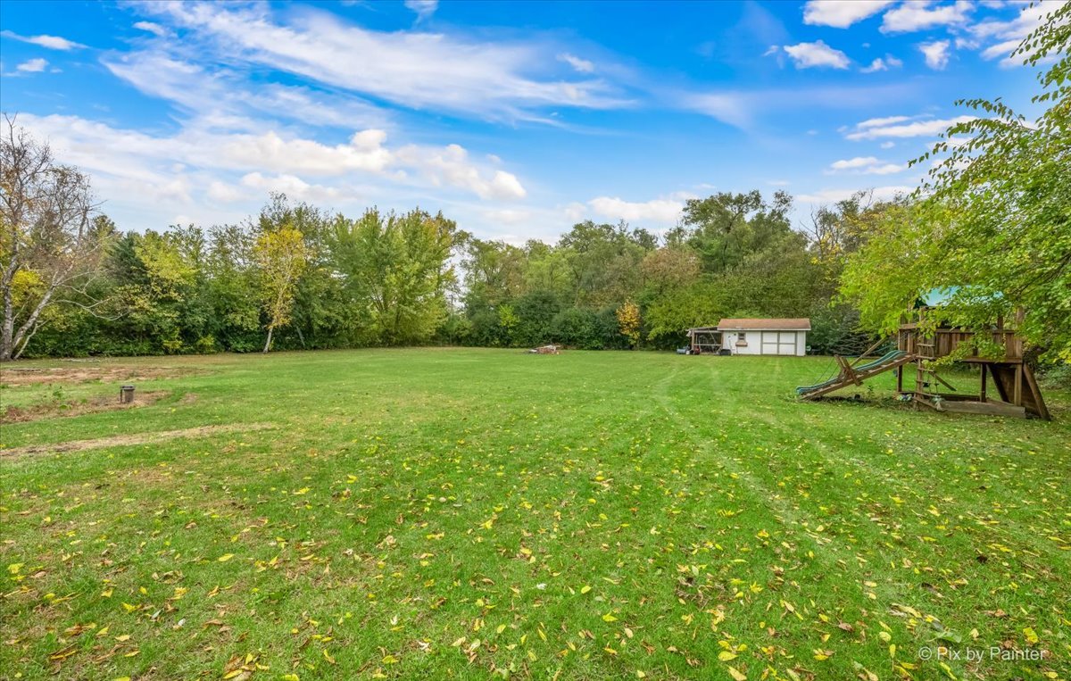 9520 Stacy Lane Union, IL 60180 - Photo 37 of 45 a view of a green field with wooden fence