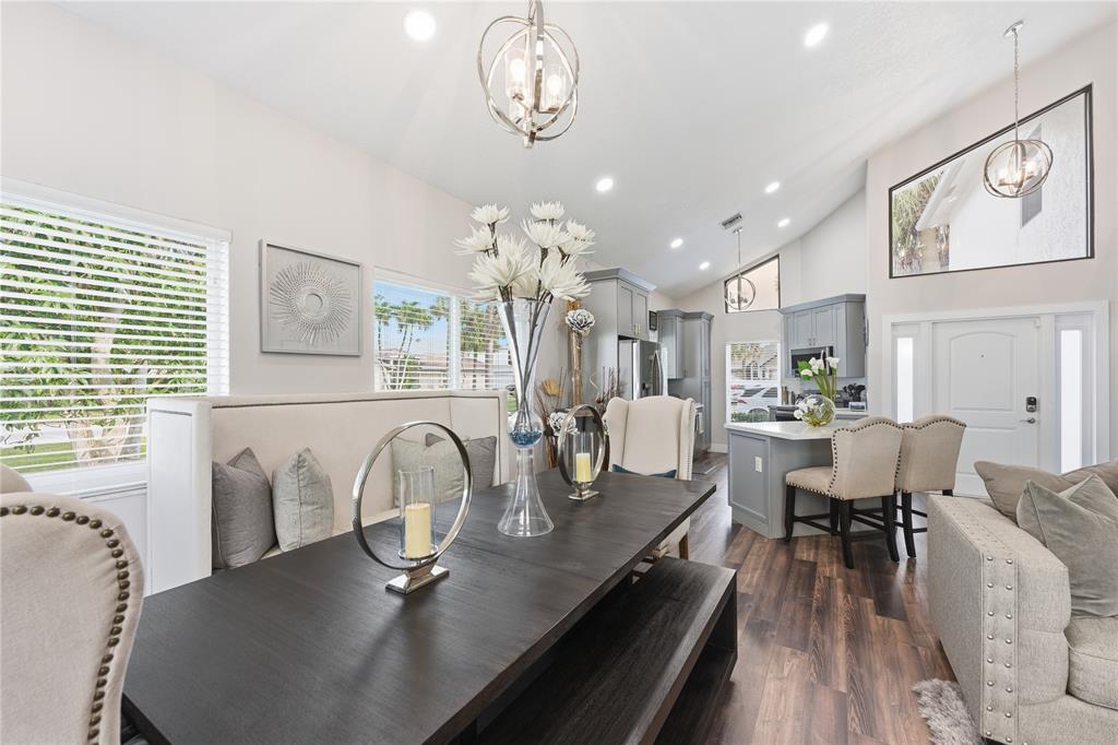 23367 Boca Trace Drive Boca Raton, FL 33433 - Photo 13 of 34 a view of a dining room with furniture window and wooden floor
