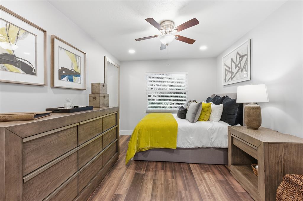 23367 Boca Trace Drive Boca Raton, FL 33433 - Photo 18 of 34 a bedroom with a bed and wooden floor