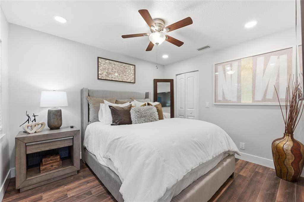 23367 Boca Trace Drive Boca Raton, FL 33433 - Photo 19 of 34 a bedroom with a bed and a chandelier