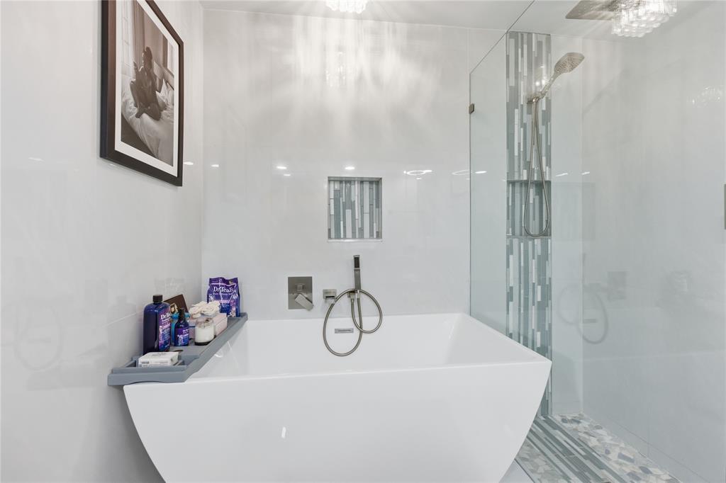 23367 Boca Trace Drive Boca Raton, FL 33433 - Photo 21 of 34 a bathroom with a granite countertop sink a mirror and shower