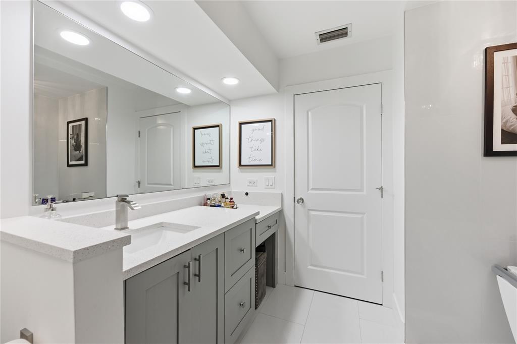 23367 Boca Trace Drive Boca Raton, FL 33433 - Photo 22 of 34 a bathroom with 2 sink and a mirror