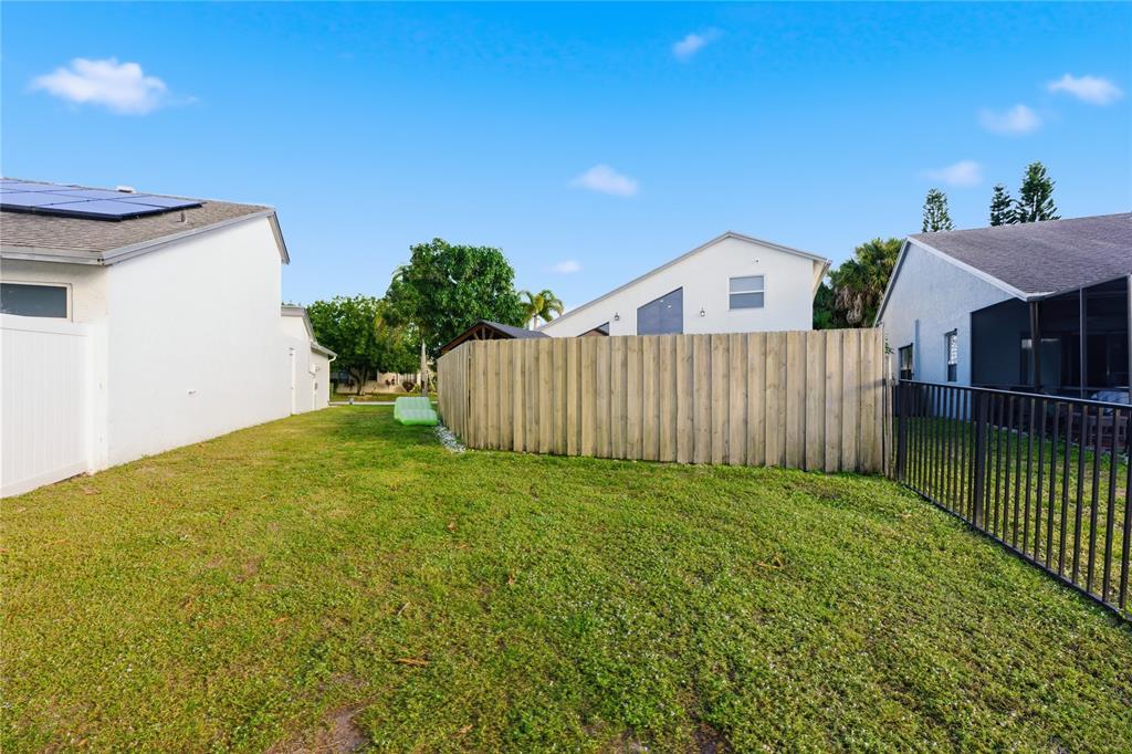23367 Boca Trace Drive Boca Raton, FL 33433 - Photo 31 of 34 a view of a house with a backyard