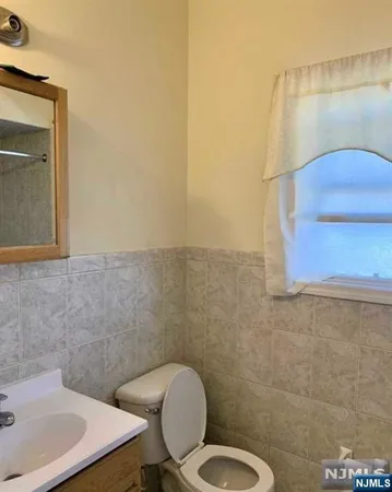 a bathroom with a toilet and a sink