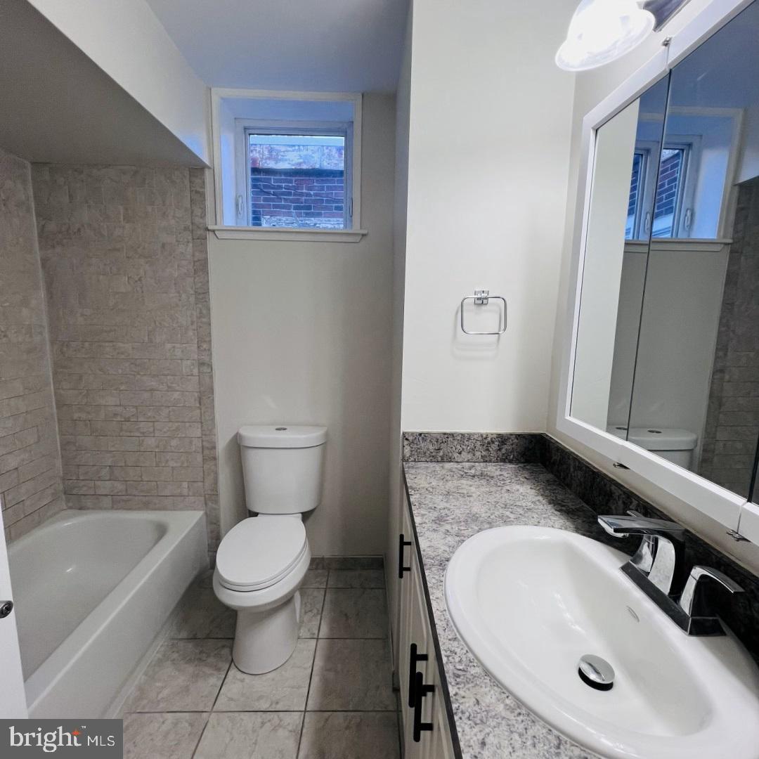 619 South 42nd Street Philadelphia, PA 19104 - Photo 15 of 25 a bathroom with a sink toilet and shower