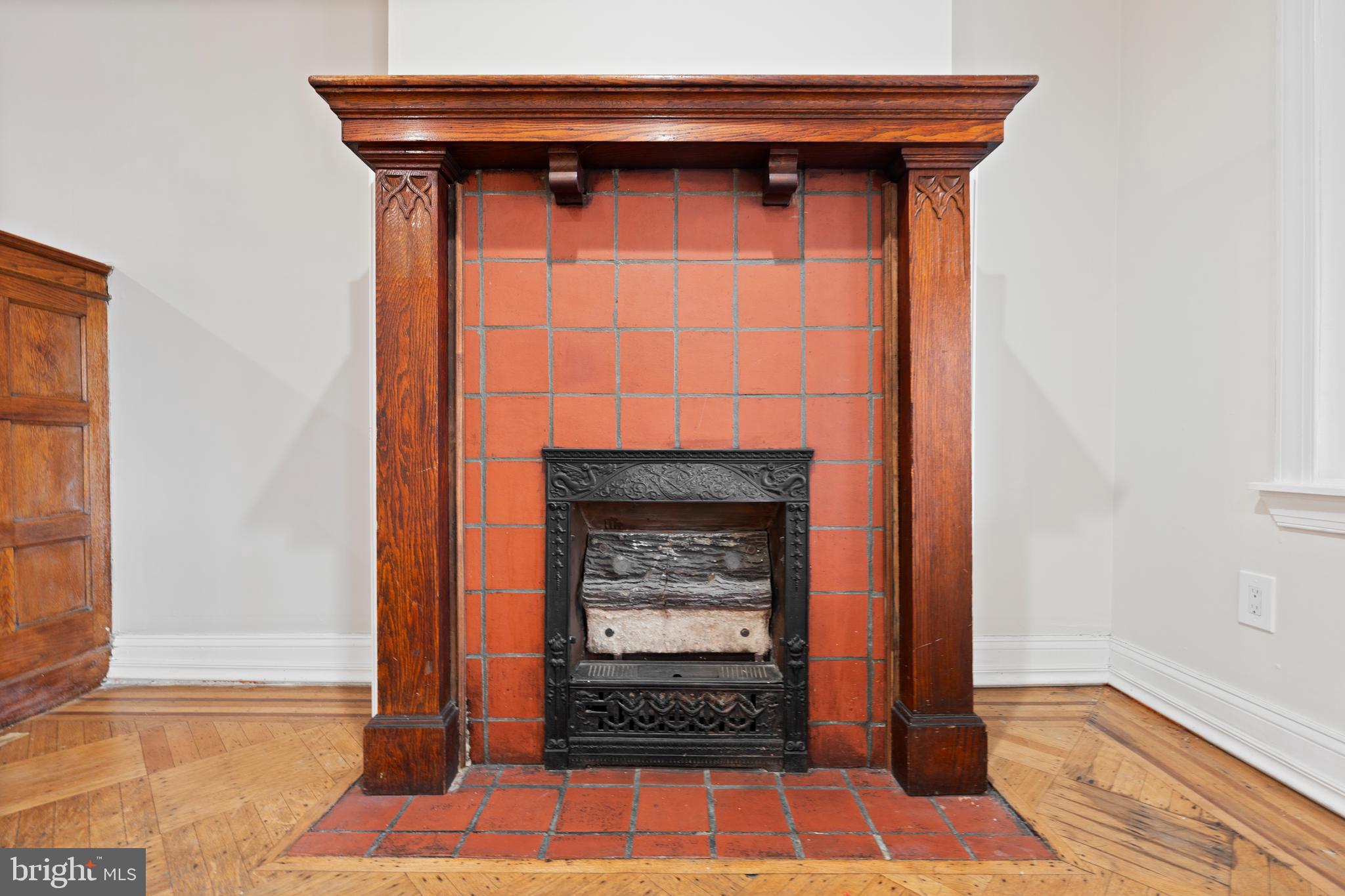 619 South 42nd Street Philadelphia, PA 19104 - Photo 6 of 30 a room with fireplace and a wooden floor