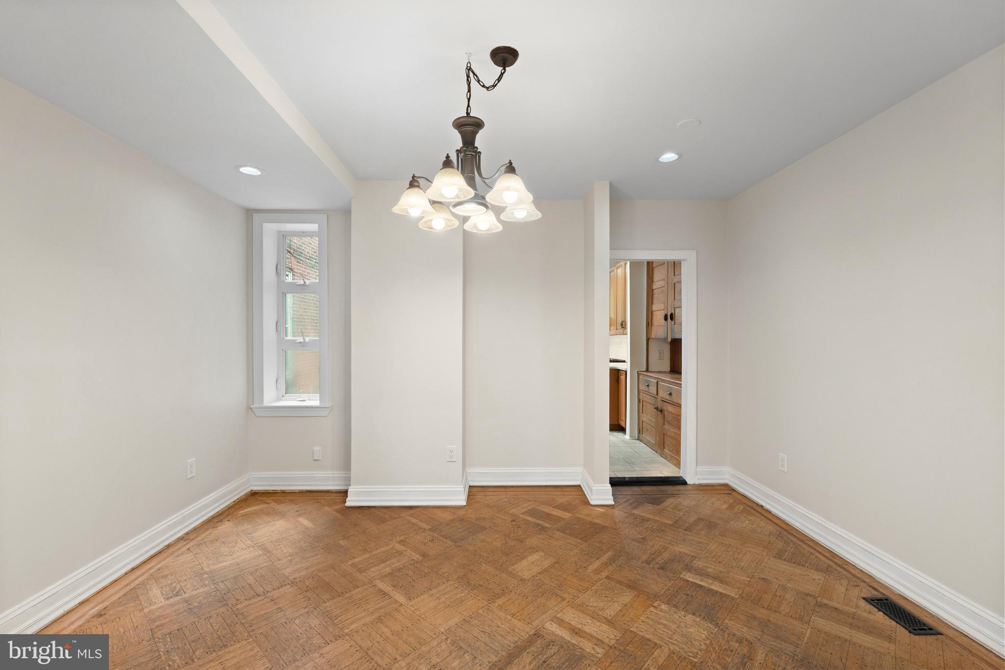 619 South 42nd Street Philadelphia, PA 19104 - Photo 10 of 30 a view of an empty room with a chandelier