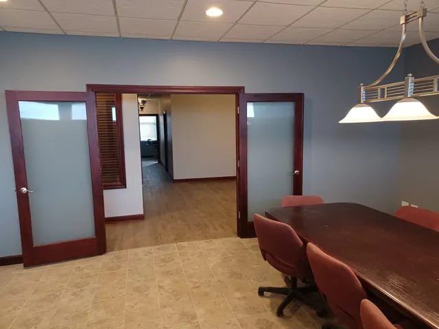 a workspace with furniture and window