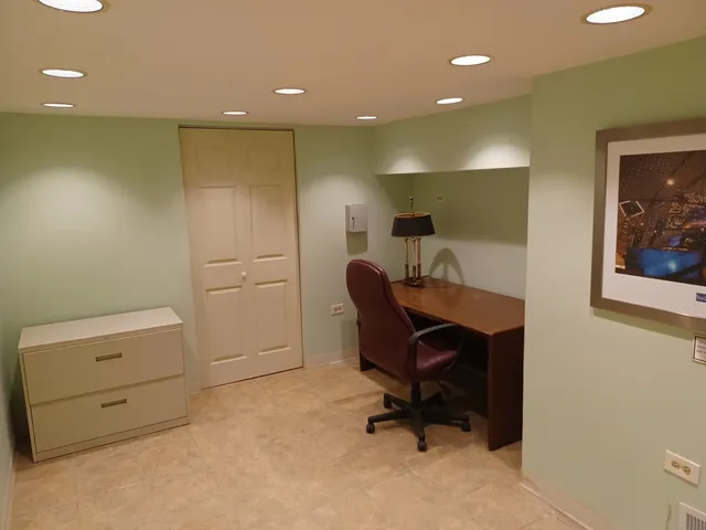 a view of a workspace with furniture