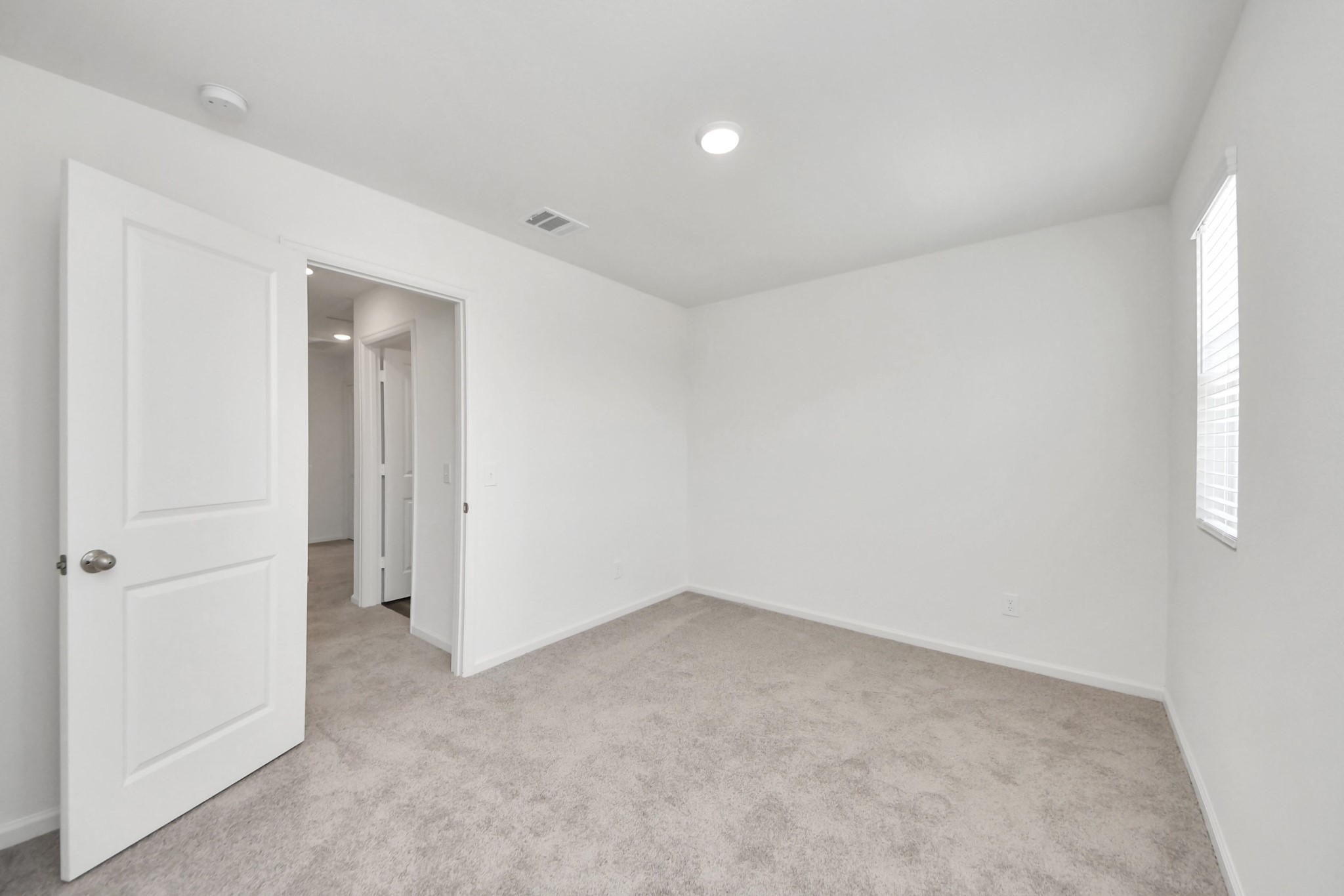 10303 Rose Mar Drive, Unit B Rosharon, TX 77583 - Photo 34 of 49 an empty room with a natural light