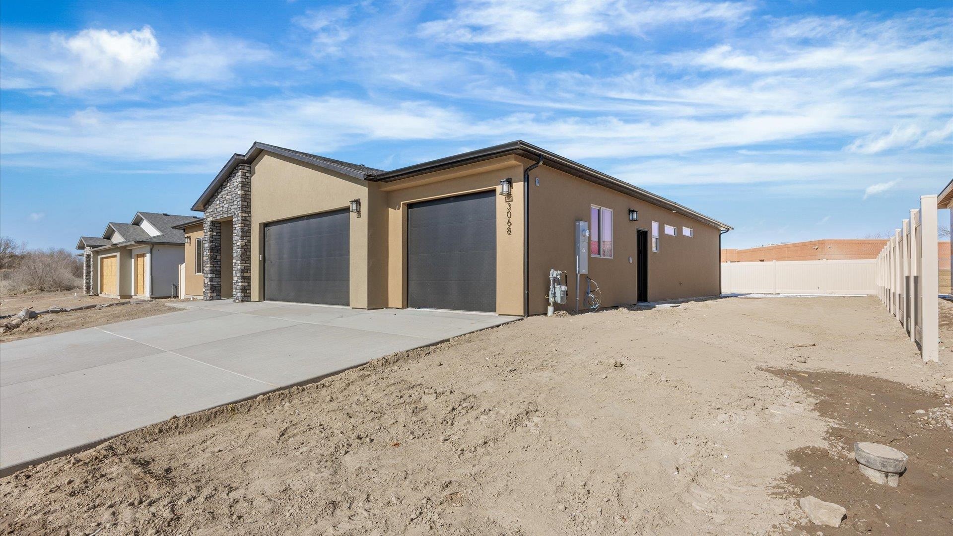 3068 Thunderhead Way Grand Junction, CO 81504 - Photo 4 of 7 a house view with a outdoor space