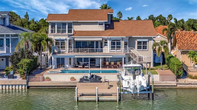 an aerial view of a houses with ocean view