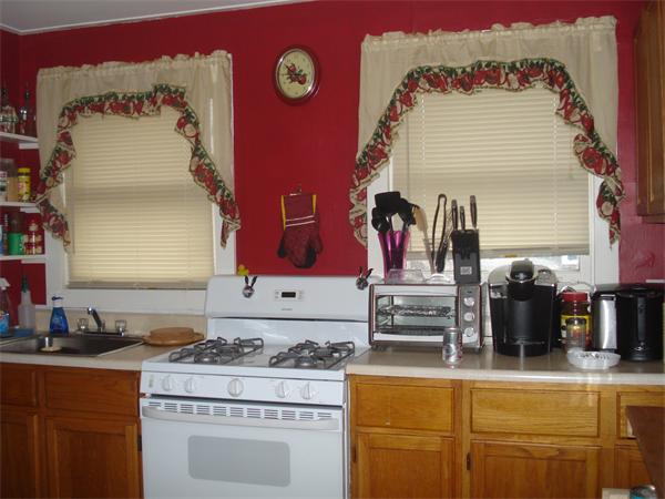 21 12th Street Wareham, MA 02558 - Photo 6 of 9 a kitchen with a stove and a refrigerator