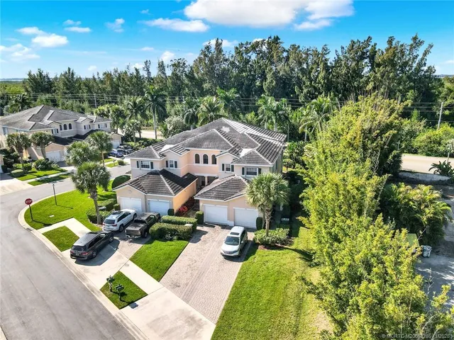 an aerial view of a house with a garden and plants