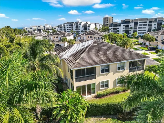 a view of a house with a yard and plants