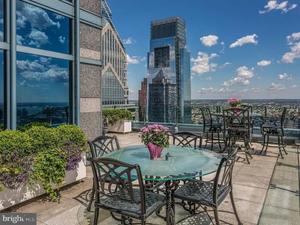 a view of a chairs and table in the terrace