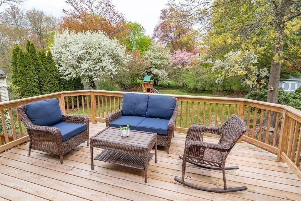 15 Nimitz Circle Natick, MA 01760 - Photo 12 of 21 a roof deck with couches and wooden fence