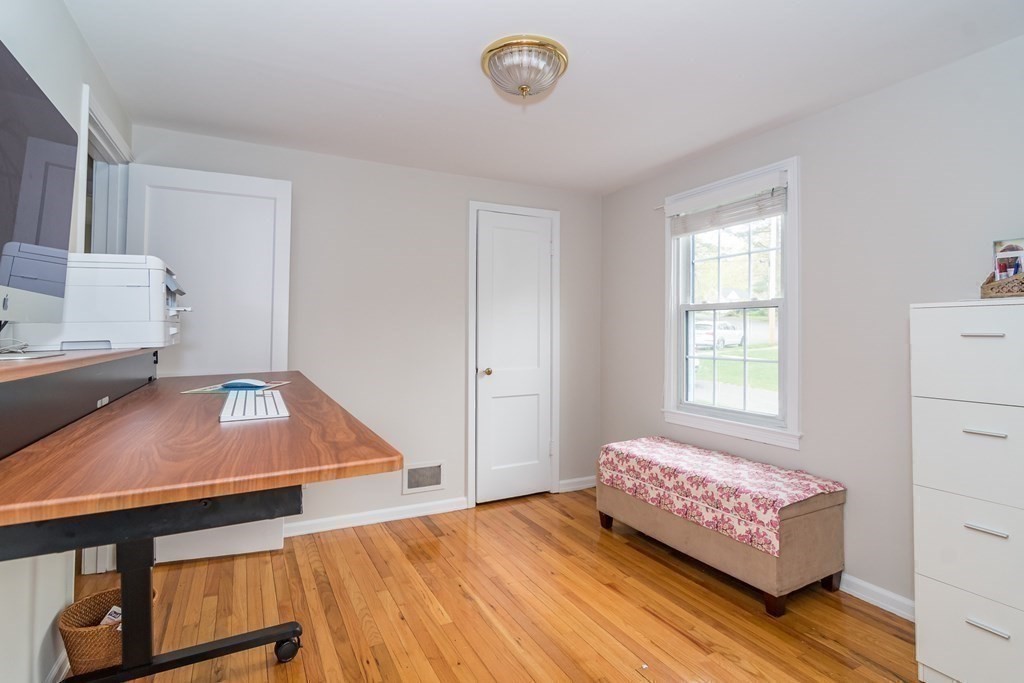 15 Nimitz Circle Natick, MA 01760 - Photo 16 of 21 a living room with a bed and a window