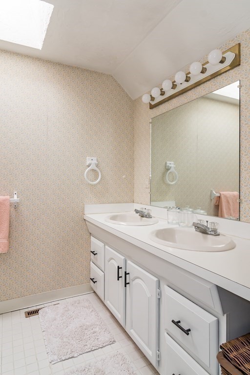 15 Nimitz Circle Natick, MA 01760 - Photo 18 of 21 a bathroom with a sink and mirror