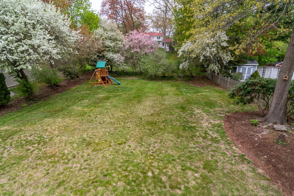 15 Nimitz Circle Natick, MA 01760 - Photo 21 of 21 a view of a garden with a bench