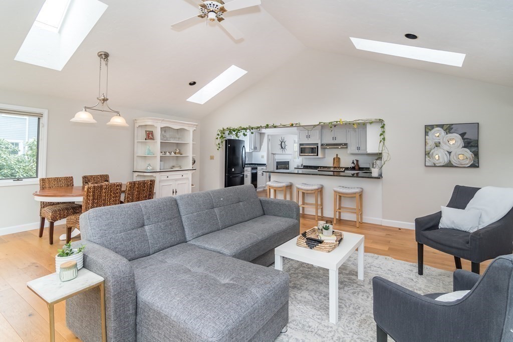 15 Nimitz Circle Natick, MA 01760 - Photo 6 of 21 a living room with furniture and a view of kitchen