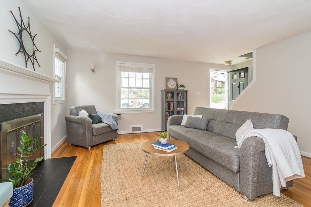 15 Nimitz Circle Natick, MA 01760 - Photo 9 of 21 a living room with furniture and a fireplace