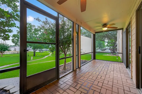 a view of a porch and garden