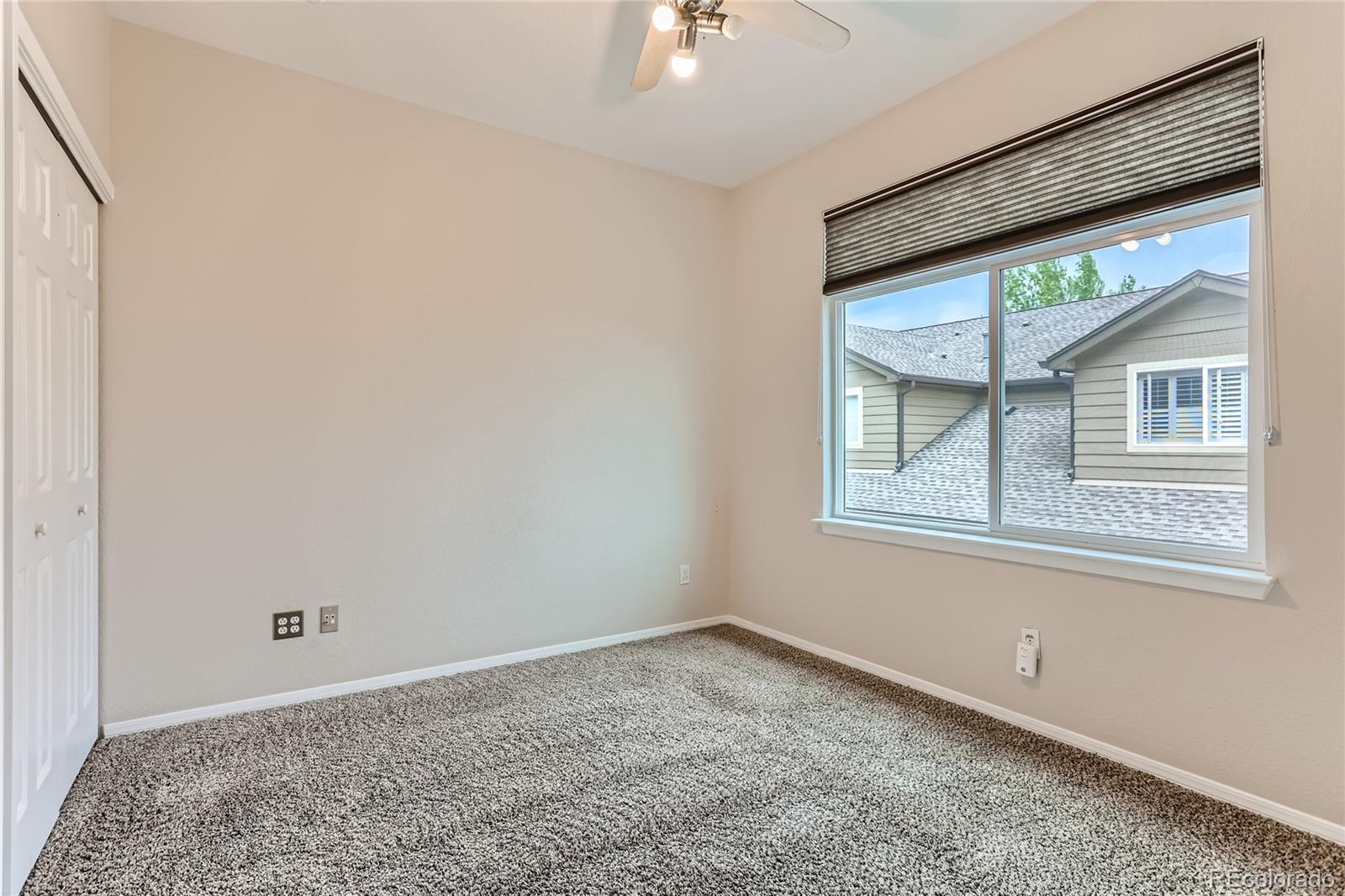 6478 Silver Mesa Drive, Unit E Highlands Ranch, CO 80130 - Photo 14 of 34 a view of empty room with windows