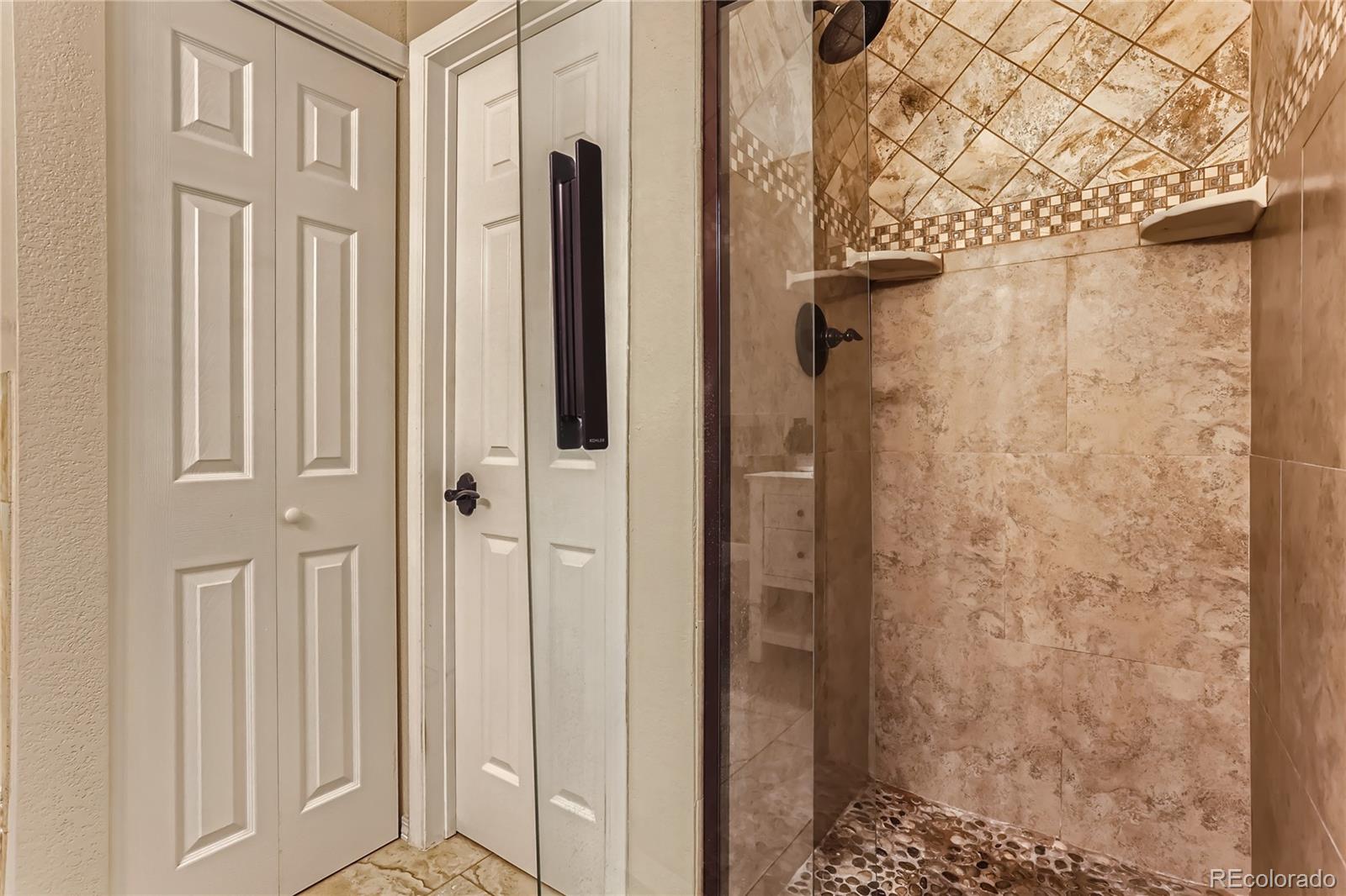 6478 Silver Mesa Drive, Unit E Highlands Ranch, CO 80130 - Photo 19 of 34 a view of a bathroom