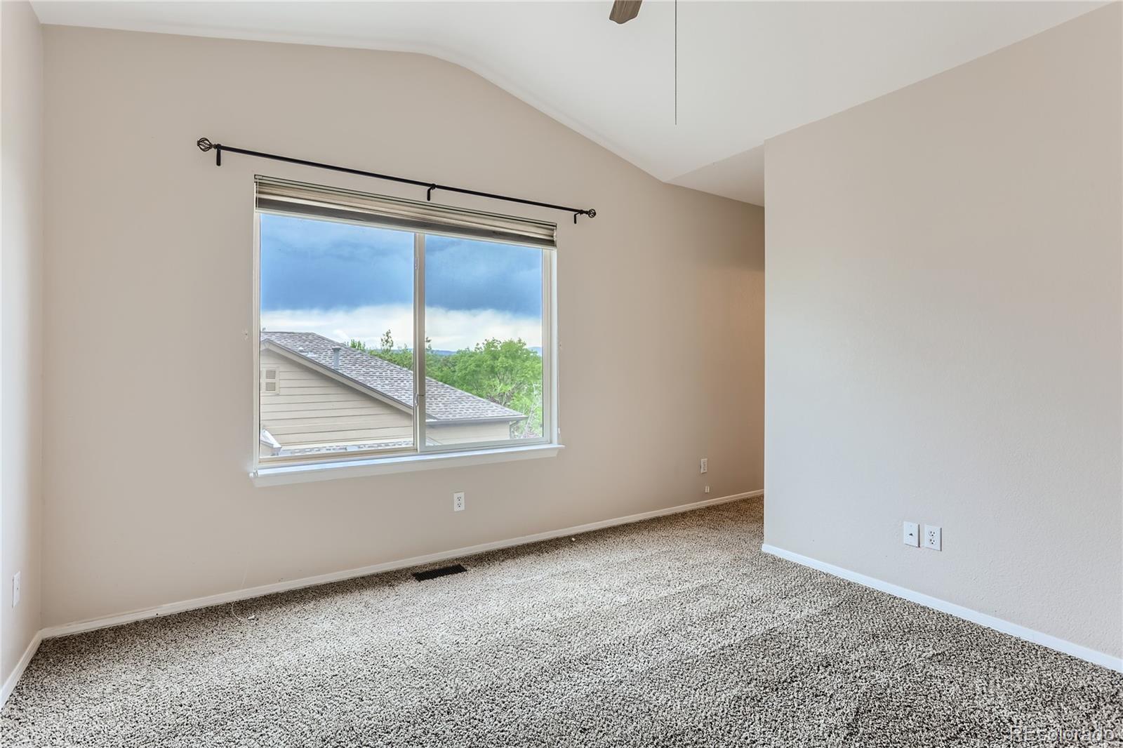 6478 Silver Mesa Drive, Unit E Highlands Ranch, CO 80130 - Photo 20 of 34 a view of an empty room with a window