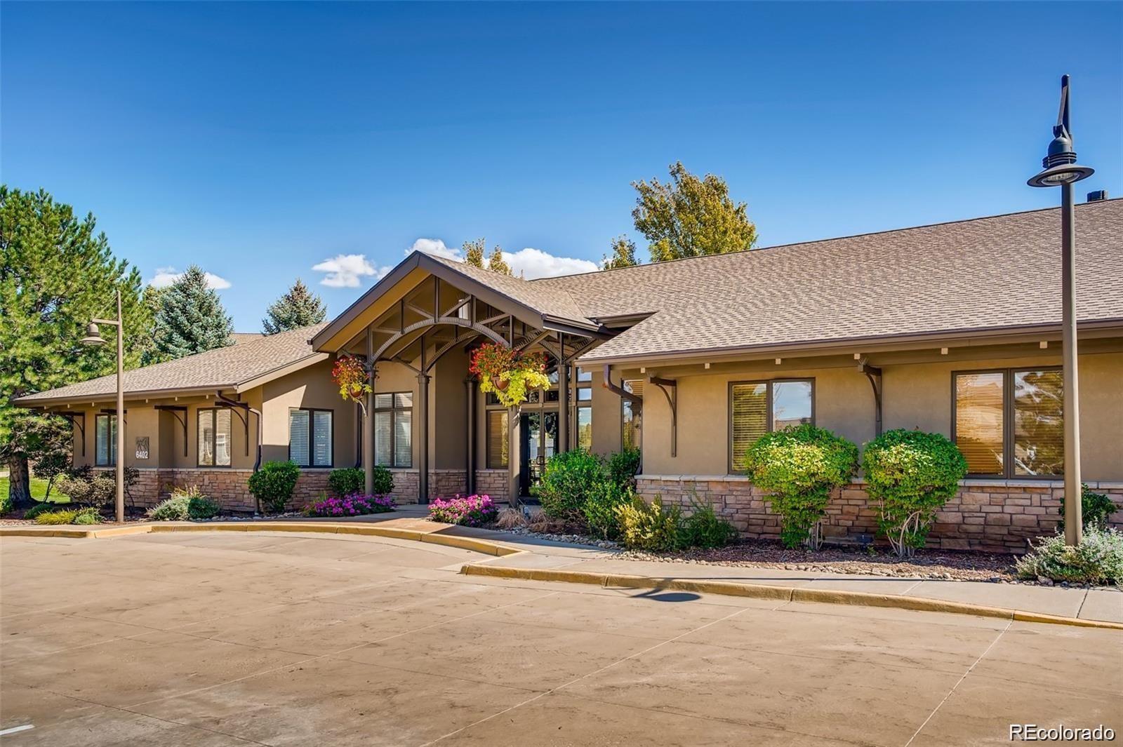 6478 Silver Mesa Drive, Unit E Highlands Ranch, CO 80130 - Photo 29 of 34 front view of a house with a street