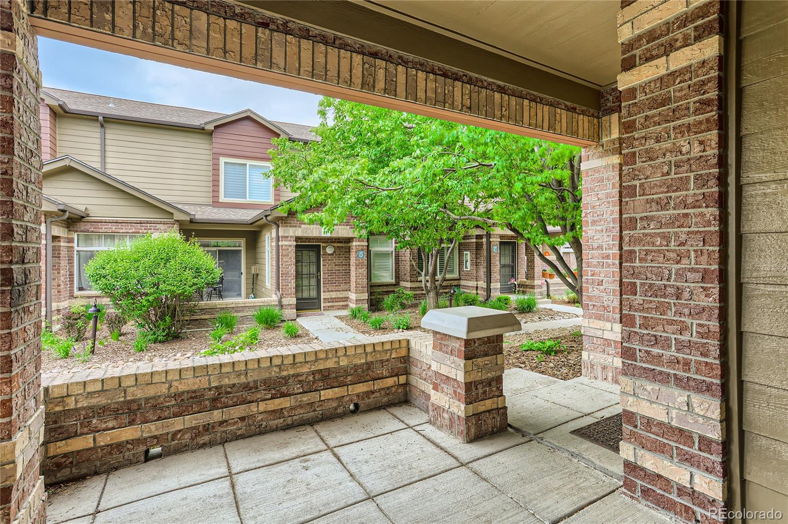 6478 Silver Mesa Drive, Unit E Highlands Ranch, CO 80130 - Photo 3 of 34 a backyard of a house with yard and outdoor seating